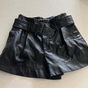 Cute faux leather shorts with belt included!
